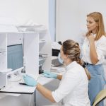 Doctor checks coronavirus test with patient